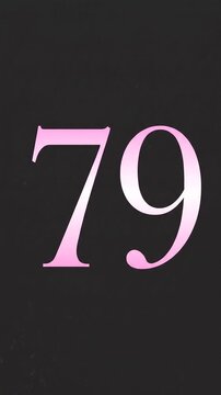 Pink Glitter Blows Away and Reveals the Number 79 on Solid Background