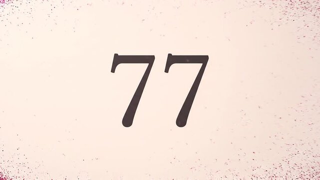 Pink Glitter Blows Away and Reveals the Number 77 on Solid Background