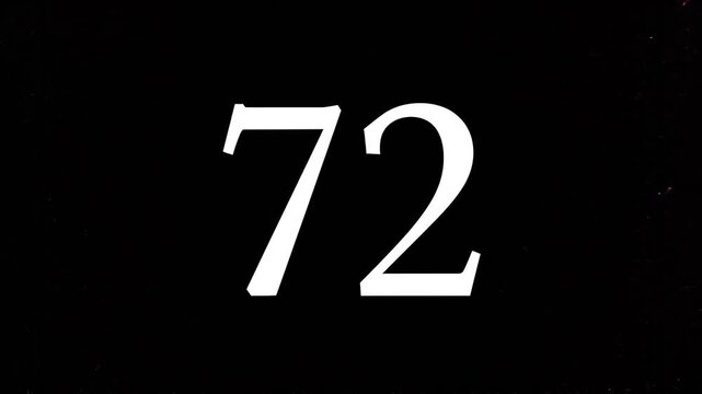 Pink Glitter Blows Away and Reveals the Number 72 on Solid Background