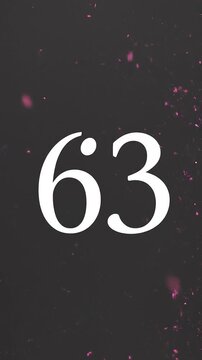 Pink Glitter Blows Away and Reveals the Number 63 on Solid Background