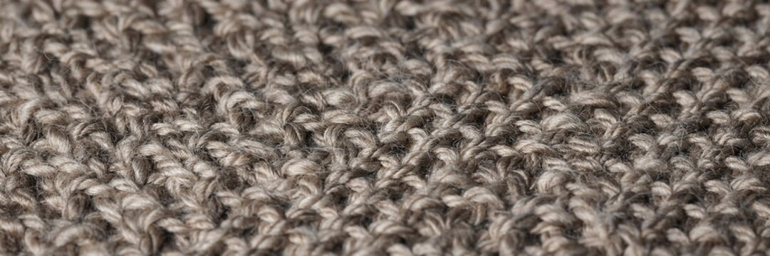 Brown knitted wool texture, handcrafted sweater knitwear detail, handwoven woolen yarn material, cozy warm fashion fabric background, handmade textile pattern close up