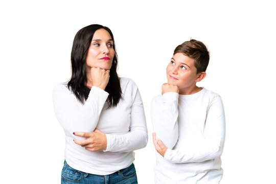 Little caucasian kid over isolated chroma key background standing and thinking an idea