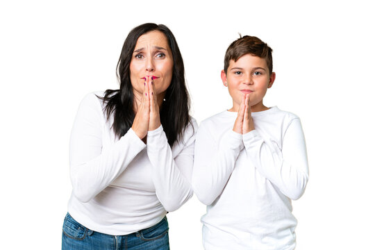 Little caucasian kid over isolated chroma key background pleading