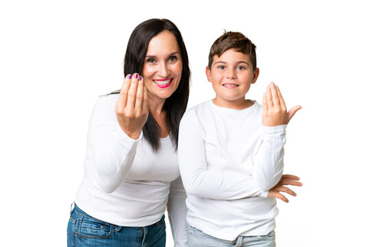 Little caucasian kid over isolated chroma key background inviting to come with hand