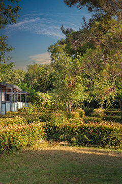 Lush resort gardens with modern cabins and green foliage. Croatia.
