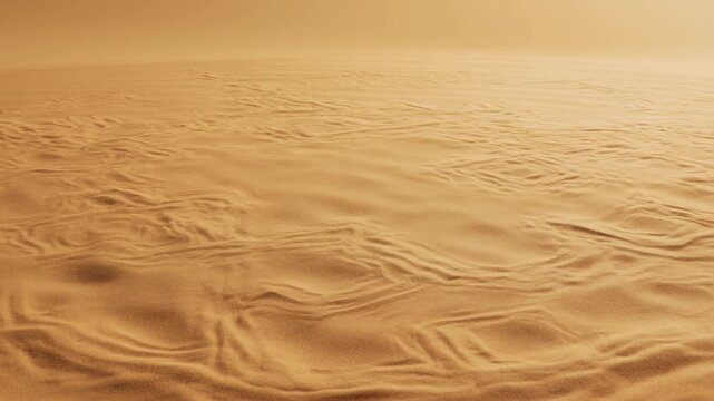 Slow pan of desert sand ripples shifting across dune plain in warm golden light at sunset