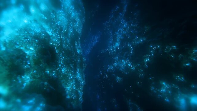 Deep Underwater Trench Illuminated by Bioluminescent Organisms Glowing in Dark Blue Water Featuring Marine Life, Animated Motion, Bioluminescence