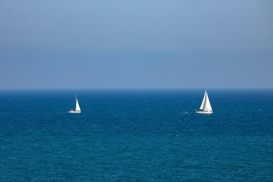 sailboats in the blue sea