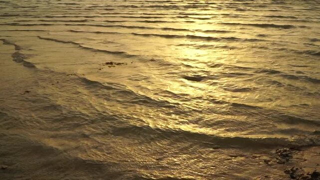 Video of golden sunset light on gentle sea waves at Ras Sudr, Egypt