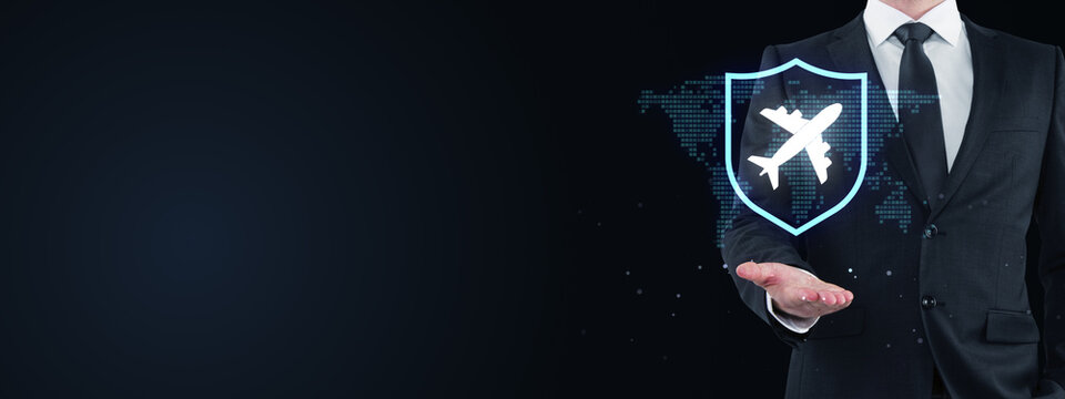 Businessman presenting airplane protection shield over global map with dark background and generous copy space for travel security design.