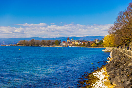 Lake Geneva shoreline with sunny Lausanne view, Switzerland