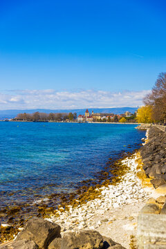 Lake Geneva shoreline with sunny Lausanne view, Switzerland
