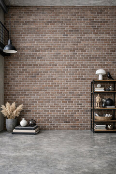 A cozy corner of a modern home featuring a brick wall, wooden floor, and books on a shelf.