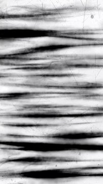 Animation of a black and white background with sloppy horizontal lines in hand-drawn ink and noise, geometric background with looping motion.