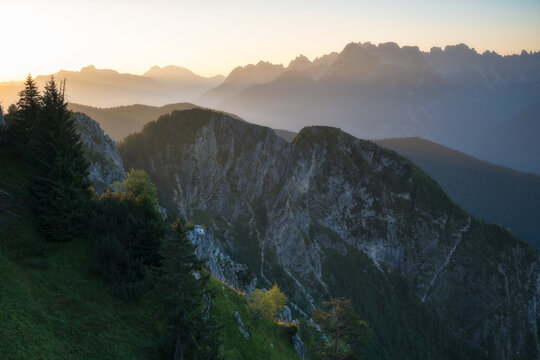 Breathtaking mountain landscape at sunrise with atmospheric mist. High-quality wilderness shot ideal for travel and outdoor brands.