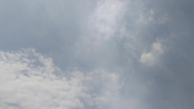 Timelapse soaring through a clear blue sky