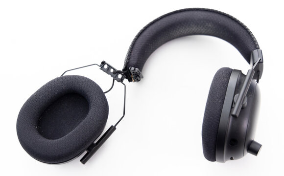 Broken Black Over Ear Headphones Lying on White Background