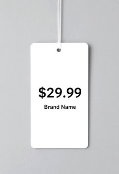 Blank white retail price tag with string loop showing a printed price label isolated on transparent background