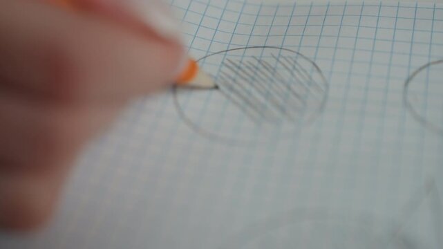 White hand with shading and grid. Unfocused hand illustration shaded on graph paper during practice session. Vague depiction of hand within shaded circle on graph paper used for exam training