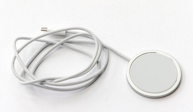 White magnetic wireless charger puck with braided usb c cable