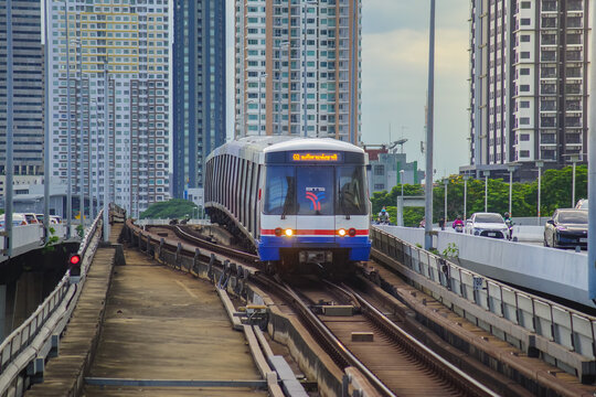 Bangkok, Thailand - June  16, 2026 : The BTS Sky Train Passing Taksin Bridge (Saphan Taksin or Saphan Sathorn) in the afternoon.