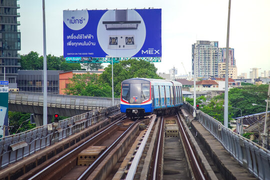 Bangkok, Thailand - June  16, 2026 : A BTS Skytrain pulling into Saphan Taksin Station in the afternoon.