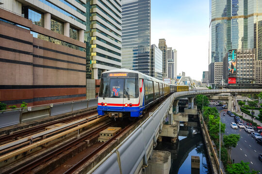 Bangkok, Thailand - June  16, 2026 : BTS Skytrain is entering Chong Nonsi Station, passing the skywalk, which is a check-in point in Bangkok, Thailand.