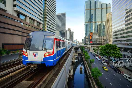 Bangkok, Thailand - June  16, 2026 : BTS Skytrain is entering Chong Nonsi Station, passing the skywalk, which is a check-in point in Bangkok, Thailand.