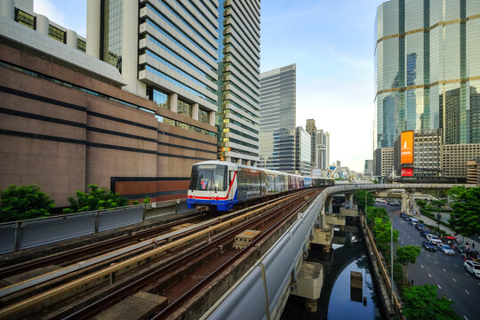 Bangkok, Thailand - June  16, 2026 : BTS Skytrain is entering Chong Nonsi Station, passing the skywalk, which is a check-in point in Bangkok, Thailand.