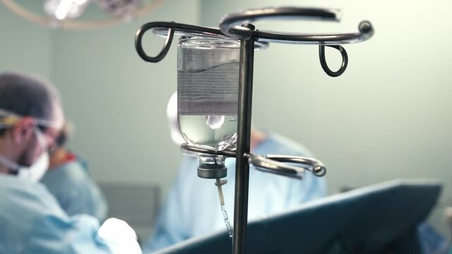 Surgical team focused during an operation in a sterile medical environment. Concept advanced surgery, clinical expertise, teamwork and modern patient care.