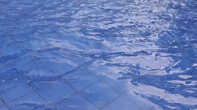 Calm Blue Swimming Pool Water Surface Ripples With Underwater Tile Pattern, Summer Resort Background