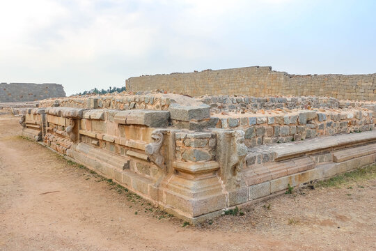 Ancient stone temple ruins and historic carved architecture in Hampi, India. Beautiful landscape with archaeological site, cultural heritage landmark and popular international tourist destination.