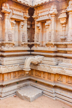 Ancient stone temple ruins and historic carved architecture in Hampi, India. Beautiful landscape with archaeological site, cultural heritage landmark and popular international tourist destination.