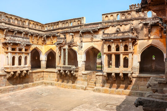 Ancient stone temple ruins and historic carved architecture in Hampi, India. Beautiful landscape with archaeological site, cultural heritage landmark and popular international tourist destination.
