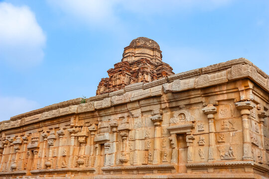 Ancient stone temple ruins and historic carved architecture in Hampi, India. Beautiful landscape with archaeological site, cultural heritage landmark and popular international tourist destination.