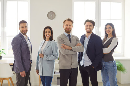 Confident business people team portrait, smiling professional coaches group leaders mentors posing together, diverse office workers, happy company staff corporate employees looking at camera