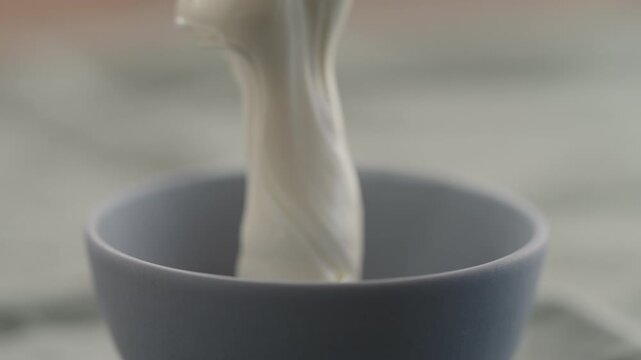 Put yogurt in a bowl closeup