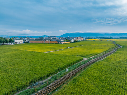 Drone panoramic landscape of Xizhou countryside, farmland and Bai ethnic dwellings in Dali China