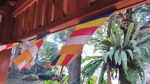Footage Of Small Colorful Buddhist Prayer Flags Waving In A Row At Hut