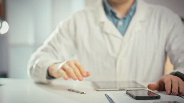During a routine medical consultation, a doctor in a white coat raises a hand to make a clear stop gesture, emphasizing authority in medicine and signaling a halt to a proposed treatment
