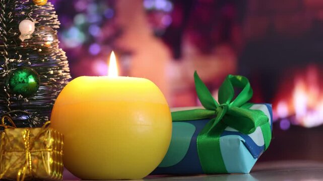 yellow-green candle, Christmas gifts, out-of-focus lights