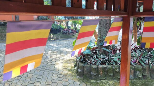 Footage Of Small Colorful Buddhist Prayer Flags Waving In A Row At Hut