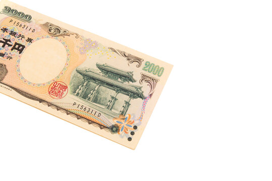 Top view of the front side of a rare 2,000 Japanese yen banknote, featuring the Shureimon gate. Scarce currency, isolated on white background. Finance and collectibles.