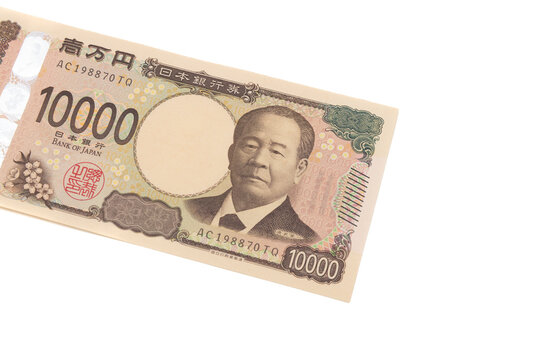 Top view of the front side of a new 10,000 Japanese yen banknote (Series E) featuring Eiichi Shibusawa. Currency isolated on white background. Finance and cash concepts.