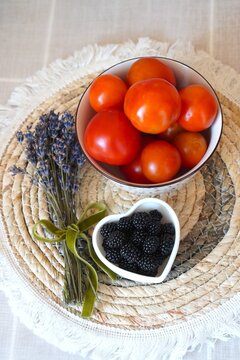 Fresh Tomatoes and Blackberries on Rustic Table Setting