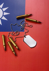 Fototapeta premium A dog tag on the taiwanese flag, serving as a conceptual backdrop representing defense