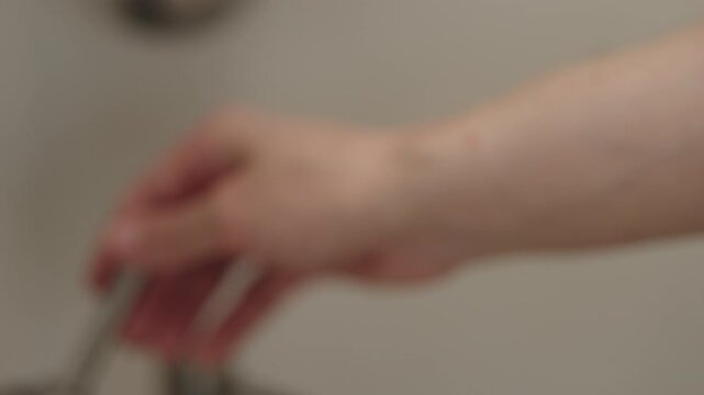Slow motion man hand wash fresh ripe blackberry