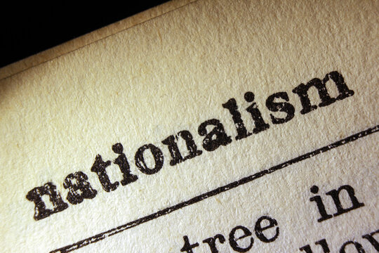 Word nationalism on dictionary page, macro close-up
