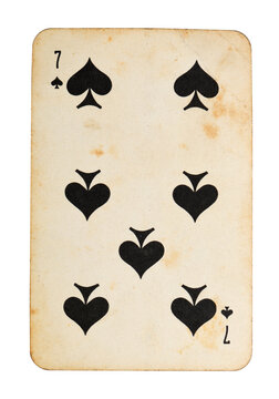 Old vintage Seven of Spades playing card isolated on white.