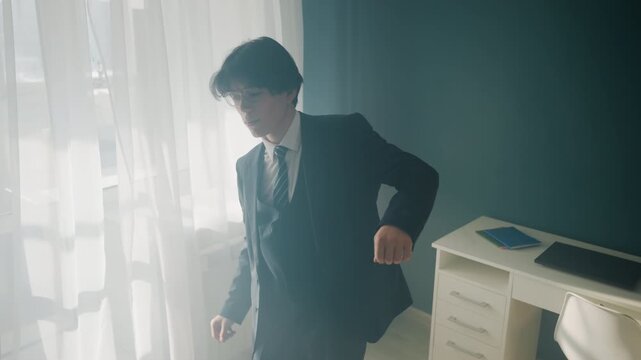 White man rehearsing gestures by window in bright office, pacing and miming presentation, nervous fidgeting, checking sleeves and tie, dramatic silhouette, tense cinematic lighting, pause and breath